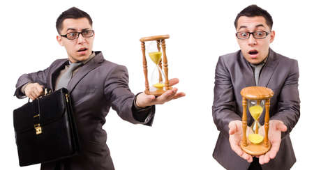 Young man holding briefcase and sandglass isolated on whiteの写真素材