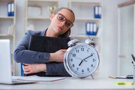 Businesswoman in time management conceptの写真素材