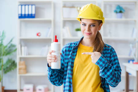 Young woman doing painting at home