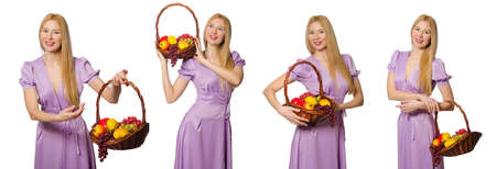 Woman with fruit basket isolated on whiteの写真素材
