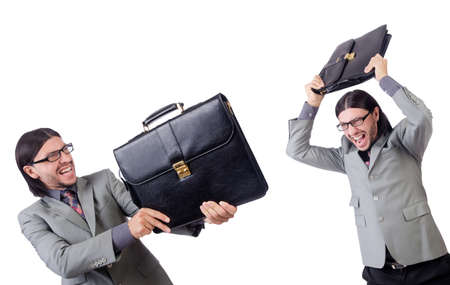 Young businessman in gray suit holding briefcase isolated on whiの写真素材