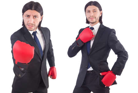 Businessman with boxing gloves on whiteの写真素材