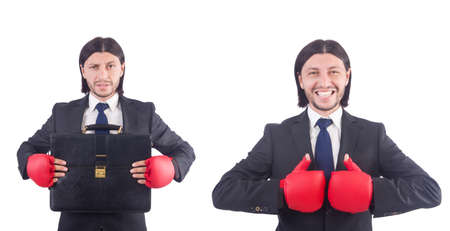 Businessman with boxing gloves on whiteの写真素材