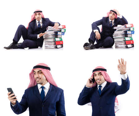 Arab businessman with many folders on whiteの写真素材