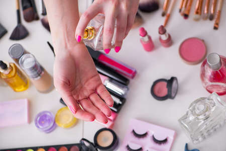 Collection of make up products displayed on the tableの写真素材