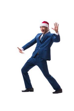 Young busnessman wearing santa hat in christmas concept on whiteの写真素材
