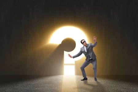 Businessman facing difficult choice dilemmaの写真素材
