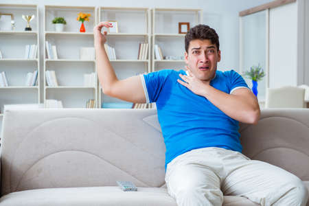 Man sweating excessively smelling bad at home