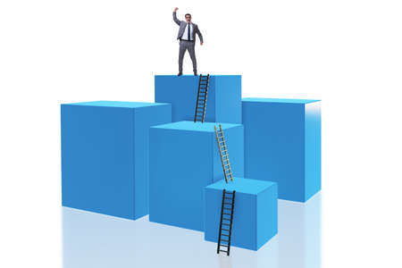 Businessman on top of block isolated on whiteの写真素材