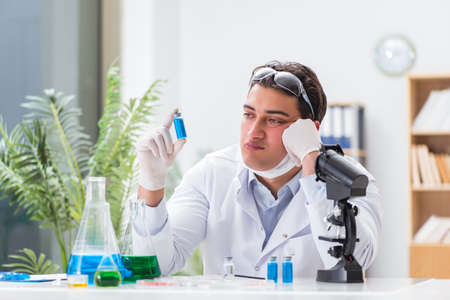 Male doctor working in the lab on virus vaccine