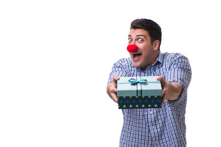 Man with a red nose funny holding a shopping bag gift present isの写真素材