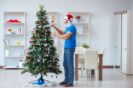 Injured man celebrating christmas at homeの写真素材