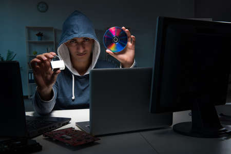 Hacker hacking computer at night