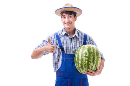 Young farmer with watermelon isolated on whiteの写真素材