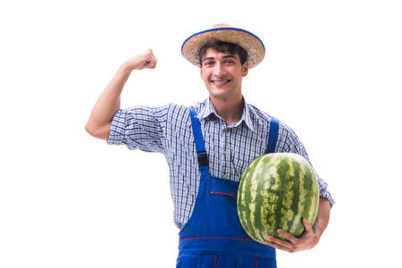Young farmer with watermelon isolated on whiteの写真素材