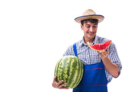 Young farmer with watermelon isolated on whiteの写真素材