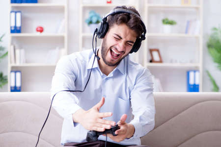 Student gamer playing games at home
