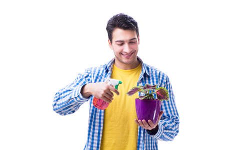 Gardener florist with a flower in a pot isolated on white backgrの写真素材