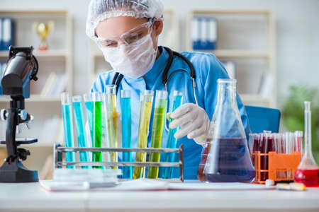 Female scientist researcher doing experiments in laboratory