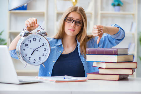 Young teenage female student preparing for exams at homeの写真素材