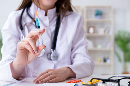 Doctor with syringe in the hospitalの写真素材