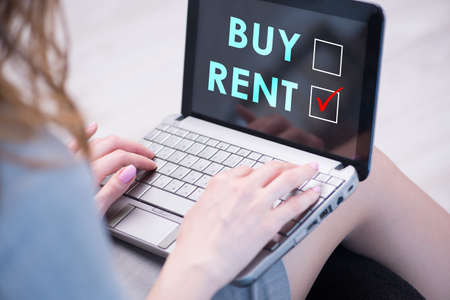 Businesswoman facing dilemma of buying versus rentingの写真素材