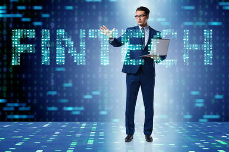 Businessman pressing buttons in fintech conceptの写真素材