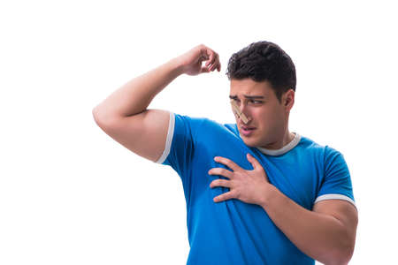 Man sweating excessively smelling bad isolated on white backgrouの写真素材