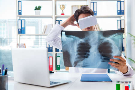 Doctor working with virtual VR reality glasses