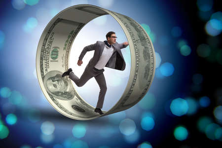 Businessman in hamster wheel chasing dollars