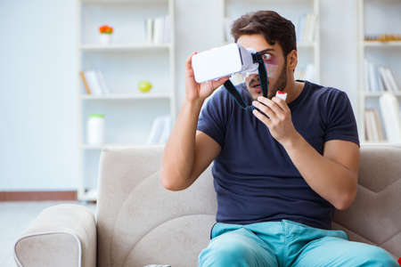 Young man defeated in sports game suffered loss with broken bleeding noseの写真素材