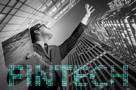 Businesswoman with laptop in financial technology fintech conceptの写真素材