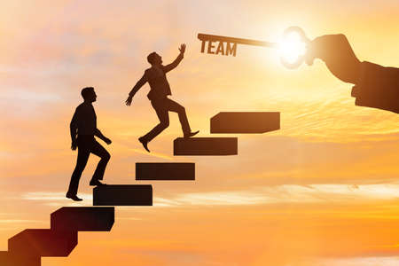 Businessmen on career ladder in teamwork concept