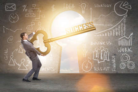 Businessman with key to success business conceptの写真素材