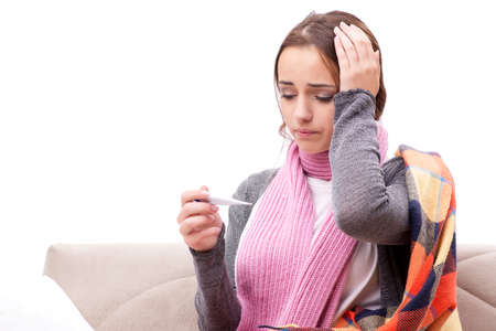 Teenager suffering from cold sitting on coach