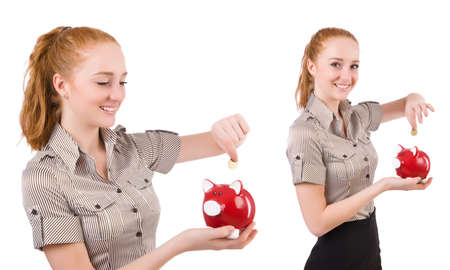 Redhead with piggybank isolated on the whiteの写真素材