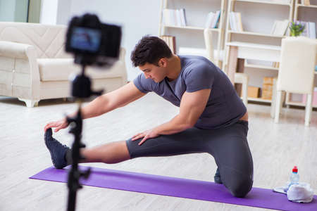Sports and health blogger recording video in sport conceptの写真素材