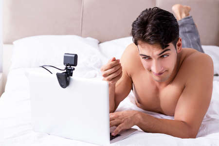 Young sexy man in online dating conceptの写真素材