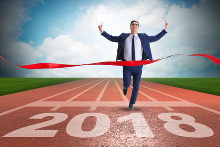 Businessman running towards new year  2018の写真素材