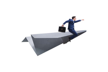 Businessman flying on paper plane in business conceptの写真素材