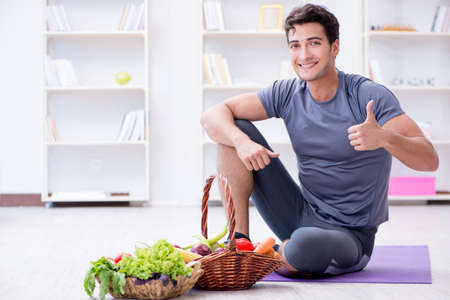 Man promoting the benefits of healthy eating and doing sportsの写真素材