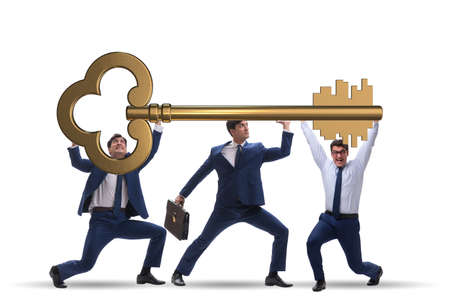Businessmen holding giant key in business conceptの写真素材