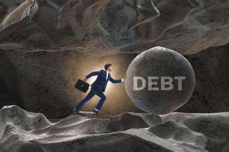 Businessman in high interest debt business conceptの写真素材