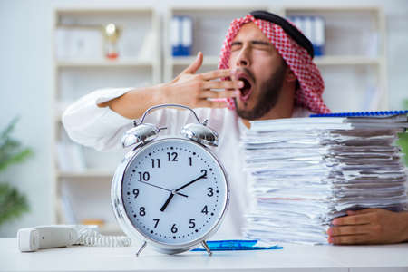 Arab businessman working in the office doing paperworkの写真素材