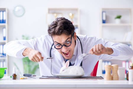 Mad crazy doctor preparing to eat rabbitの写真素材