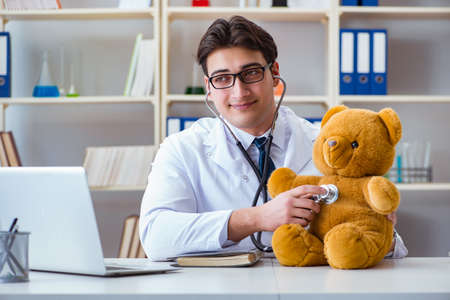 Doctor veterinary pediatrician holding an examination in the offの写真素材