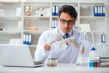 Young researcher scientist doing a water test contaminationの写真素材