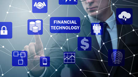 Businessman pressing buttons in fintech conceptの写真素材