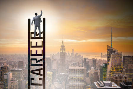 Businessman in career ladder conceptの写真素材