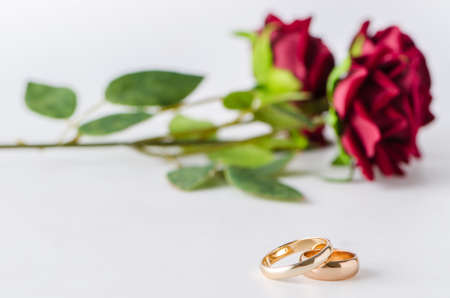 Wedding concept with rings and rosesの写真素材